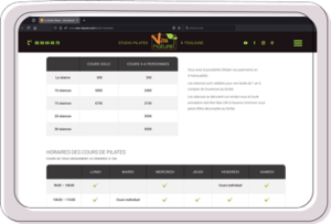 Tablette affichant tarifs et horaires Studio Pilates Toulouse